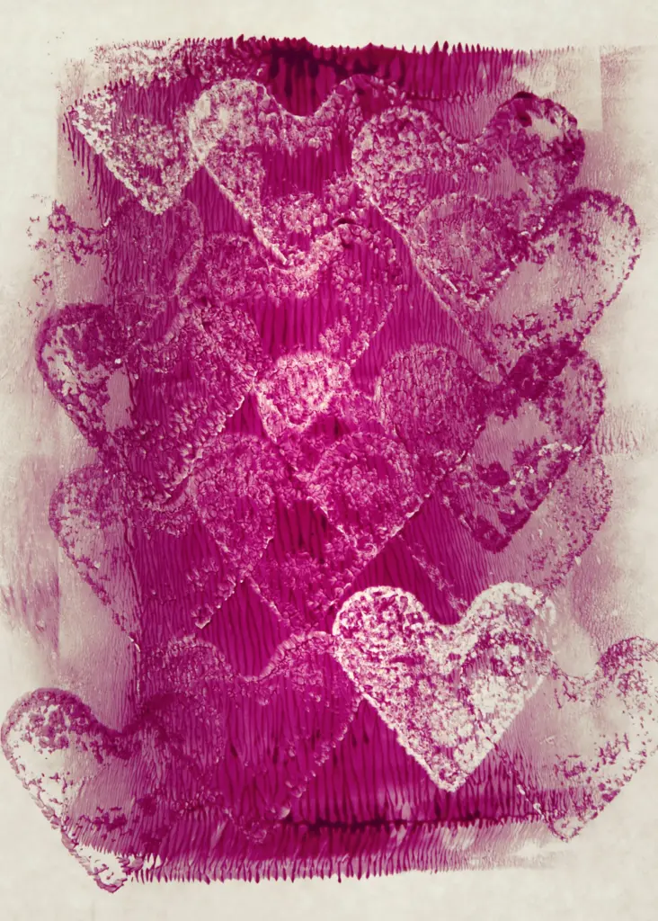 Artistic depiction of pink hearts layered on a textured canvas, representing love and creativity.